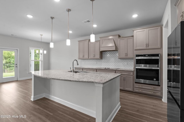 81 Eagle Claw Dr, Calabash, NC 28467 - kitchen featuring a sink, double oven, custom range hood, decorative backsplash, and dark wood-style floors