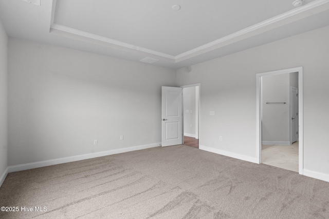 81 Eagle Claw Dr, Calabash, NC 28467 - unfurnished bedroom with a tray ceiling, carpet flooring, ornamental molding, and baseboards