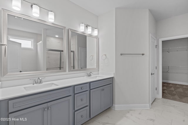 81 Eagle Claw Dr, Calabash, NC 28467 - bathroom featuring marble look tile flooring, a stall shower, double vanity, and a spacious closet