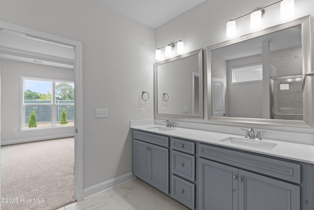 81 Eagle Claw Dr, Calabash, NC 28467 - full bathroom featuring double vanity, baseboards, a shower with door, and marble look tile flooring