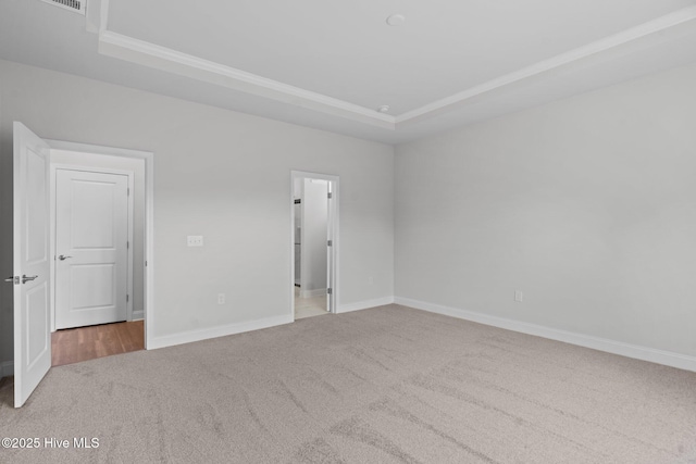 81 Eagle Claw Dr, Calabash, NC 28467 - carpeted empty room with a tray ceiling, ornamental molding, and baseboards