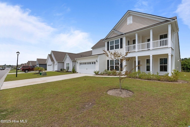81 Eagle Claw Dr, Calabash, NC 28467 - neoclassical home with driveway, an attached garage, a front yard, and a balcony