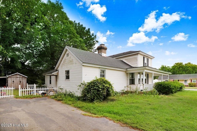 305 Court St, Gatesville, NC 27938 - view of front of property with a porch, a chimney, an outdoor structure, and roof with shingles