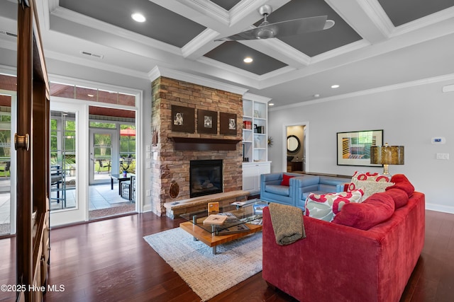 310 White Swan Ct, Wilmington, NC 28412 - living room with ornamental molding, dark wood-style flooring, beam ceiling, ceiling fan, and a stone fireplace