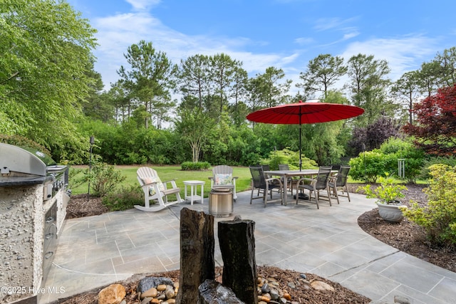 310 White Swan Ct, Wilmington, NC 28412 - view of patio / terrace with area for grilling, outdoor dining space, and view of scattered trees