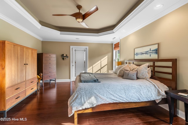 310 White Swan Ct, Wilmington, NC 28412 - bedroom with a raised ceiling, dark wood-style flooring, crown molding, baseboards, and ceiling fan