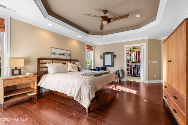 310 White Swan Ct, Wilmington, NC 28412 - bedroom with ornamental molding, a raised ceiling, multiple windows, wood finished floors, and recessed lighting