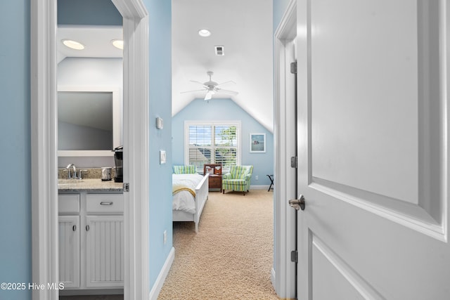 310 White Swan Ct, Wilmington, NC 28412 - hallway with carpet flooring, lofted ceiling, baseboards, and a sink