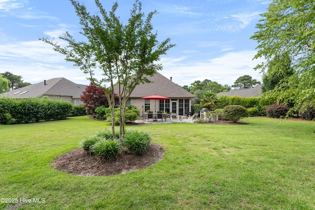 310 White Swan Ct, Wilmington, NC 28412 - view of grassy yard with a patio area
