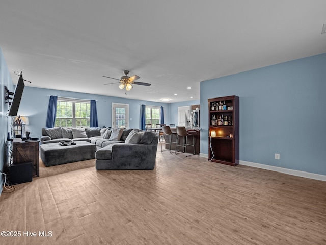 660 Riggs Rd, Hubert, NC 28539 - living room featuring a bar, wood finished floors, ceiling fan, recessed lighting, and baseboards