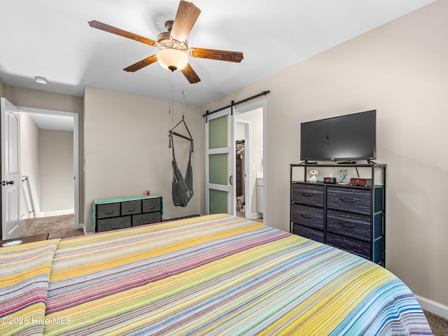 2 Catalina Cir, Swansboro, NC 28584 - bedroom with carpet floors, a barn door, baseboards, and ceiling fan