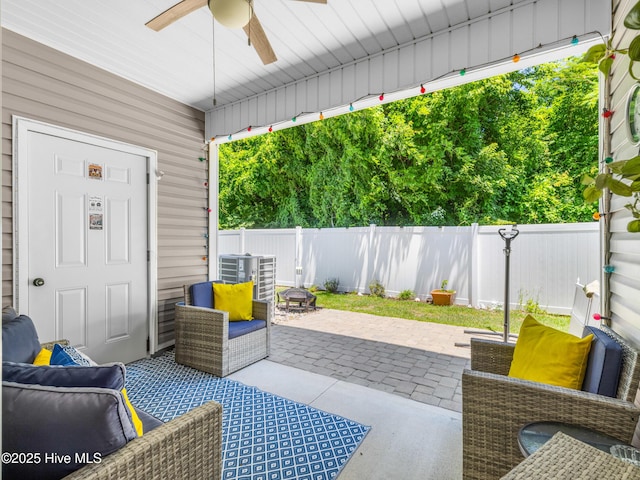 2 Catalina Cir, Swansboro, NC 28584 - fenced backyard featuring a ceiling fan, a patio, and central air condition unit