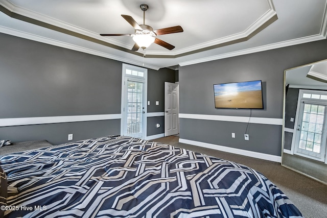 3509 Wales Pl N, Wilson, NC 27896 - bedroom with carpet flooring, a raised ceiling, crown molding, ceiling fan, and baseboards