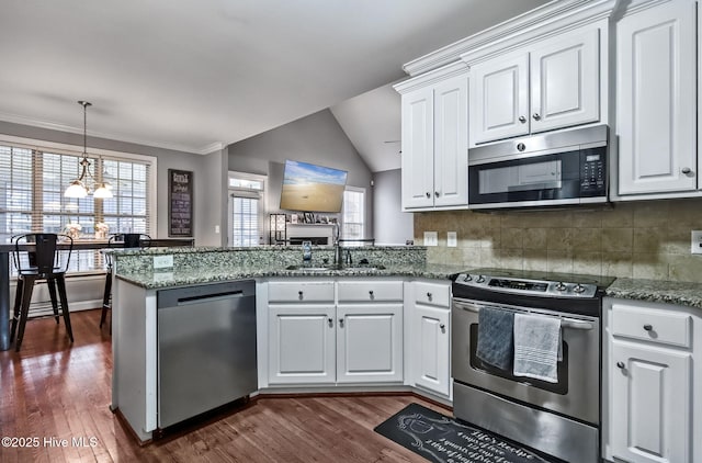 3509 Wales Pl N, Wilson, NC 27896 - kitchen with appliances with stainless steel finishes, a sink, a peninsula, dark wood-type flooring, and white cabinetry
