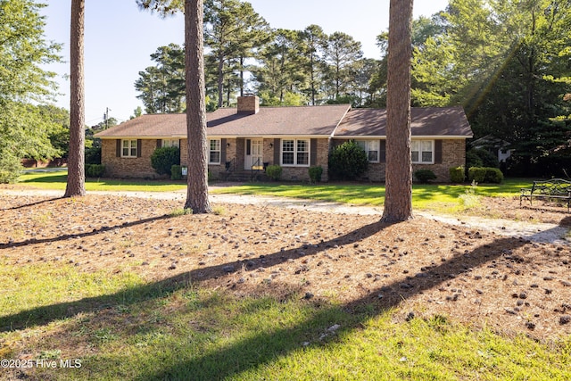 202 Forest Dr, Clinton, NC 28328 - ranch-style house featuring a chimney, a front lawn, and brick siding