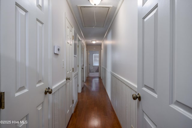 202 Forest Dr, Clinton, NC 28328 - hall featuring attic access, wainscoting, dark wood finished floors, and a decorative wall