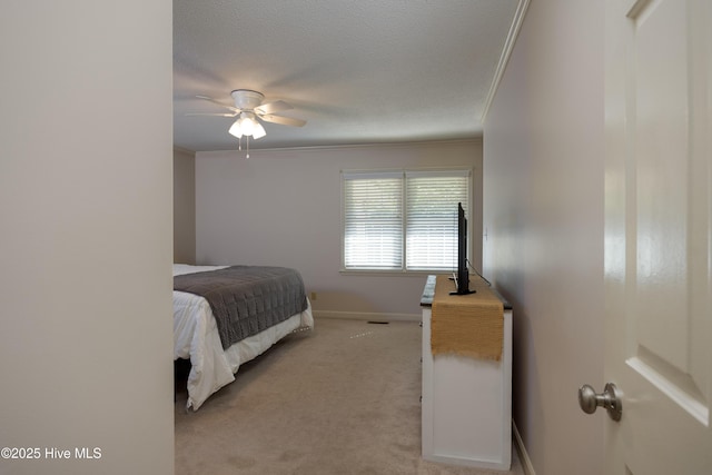 202 Forest Dr, Clinton, NC 28328 - bedroom featuring light colored carpet, baseboards, ornamental molding, and a ceiling fan