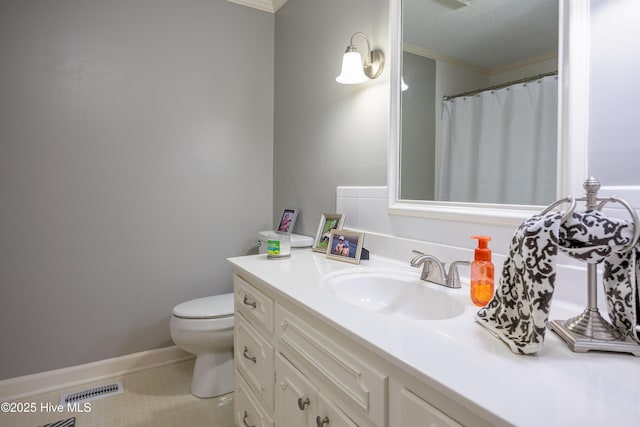 202 Forest Dr, Clinton, NC 28328 - bathroom featuring crown molding, toilet, vanity, tile patterned floors, and baseboards