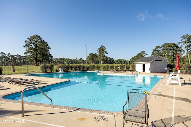 202 Forest Dr, Clinton, NC 28328 - community pool featuring a patio area and view of wooded area