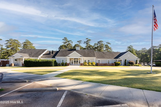202 Forest Dr, Clinton, NC 28328 - view of front of house featuring french doors, uncovered parking, and a front lawn