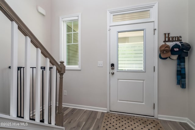 382 Sandy Brook Ct, Supply, NC 28462 - entrance foyer featuring wood finished floors, stairway, and baseboards