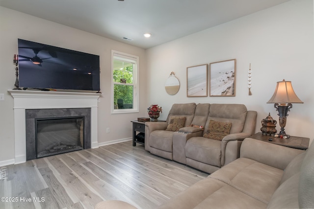382 Sandy Brook Ct, Supply, NC 28462 - living room with wood finished floors, a glass covered fireplace, and baseboards
