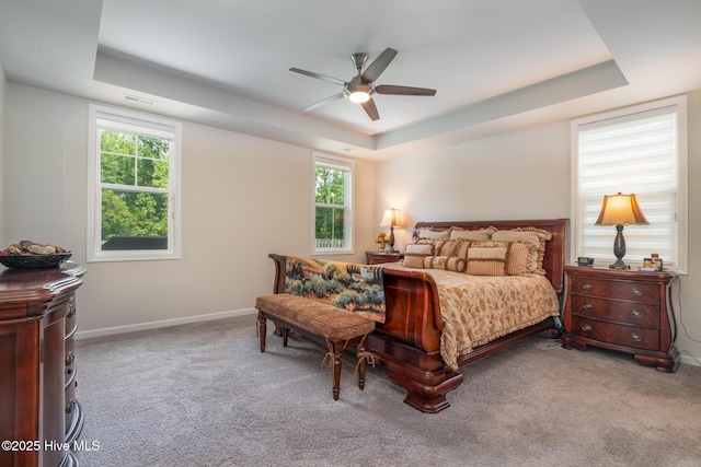 382 Sandy Brook Ct, Supply, NC 28462 - carpeted bedroom with a tray ceiling, baseboards, and ceiling fan