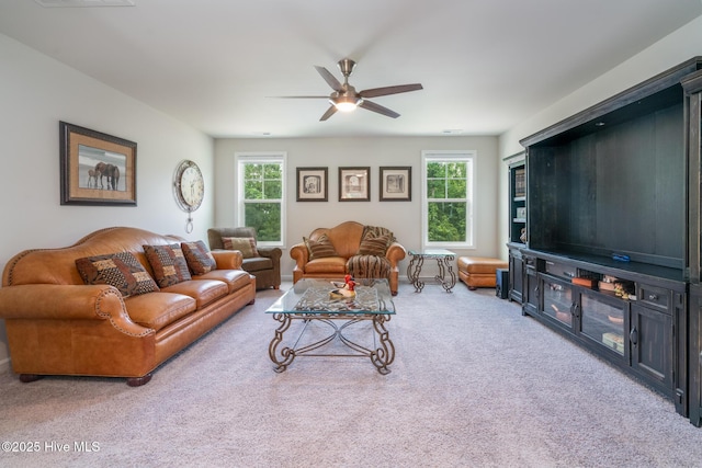 382 Sandy Brook Ct, Supply, NC 28462 - carpeted living area featuring a ceiling fan and plenty of natural light