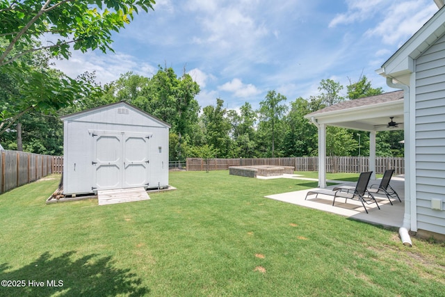 382 Sandy Brook Ct, Supply, NC 28462 - view of yard with an outdoor fire pit, a patio area, and a ceiling fan