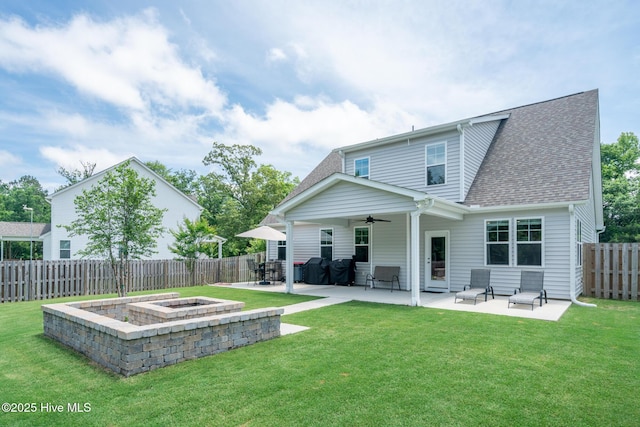 382 Sandy Brook Ct, Supply, NC 28462 - back of property with a fire pit, a ceiling fan, a patio area, and a shingled roof