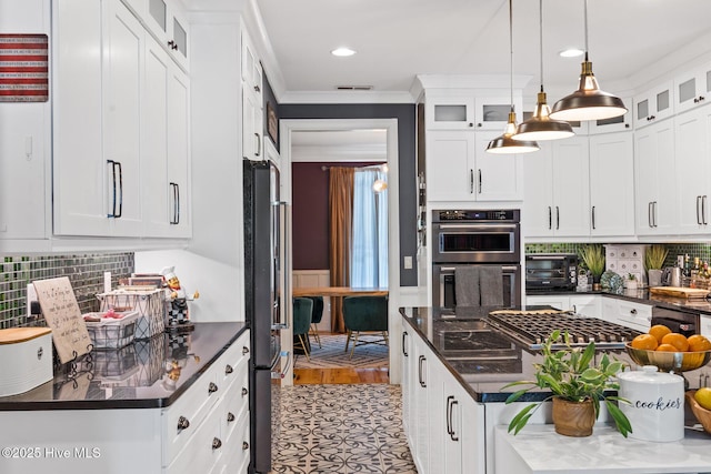 3108 Rivendell Pl, Wilmington, NC 28411 - kitchen featuring stainless steel appliances, white cabinets, tasteful backsplash, decorative light fixtures, and crown molding