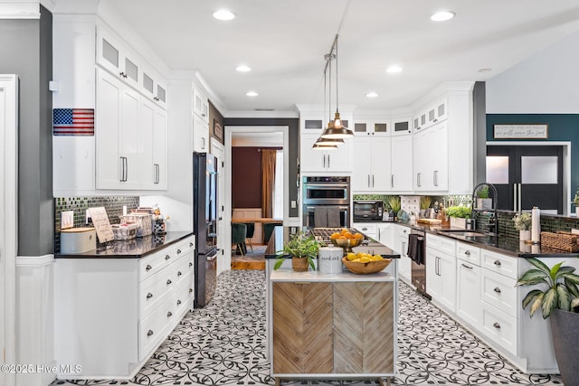 3108 Rivendell Pl, Wilmington, NC 28411 - kitchen featuring fridge with ice dispenser, double oven, white cabinets, dishwashing machine, and recessed lighting