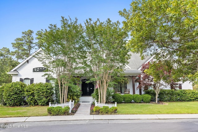 3108 Rivendell Pl, Wilmington, NC 28411 - view of property hidden behind natural elements featuring a front yard