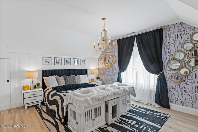 3108 Rivendell Pl, Wilmington, NC 28411 - bedroom with vaulted ceiling, a chandelier, and light wood-style flooring