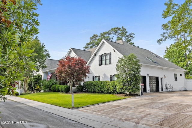 3108 Rivendell Pl, Wilmington, NC 28411 - view of front of home with a front lawn, a shingled roof, and driveway