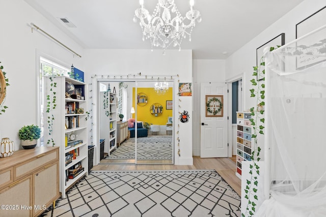 3108 Rivendell Pl, Wilmington, NC 28411 - foyer with a chandelier and light wood-style flooring
