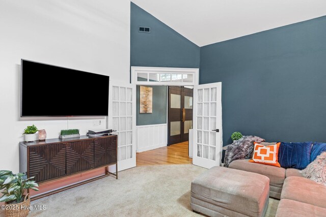 3108 Rivendell Pl, Wilmington, NC 28411 - carpeted living room with french doors and high vaulted ceiling