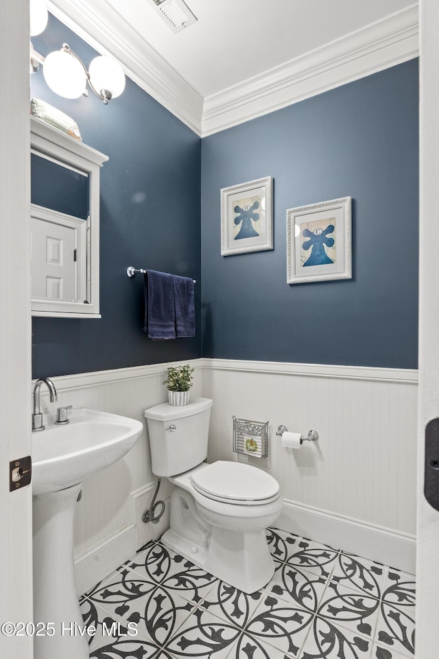 3108 Rivendell Pl, Wilmington, NC 28411 - half bathroom with wainscoting, crown molding, and tile patterned flooring