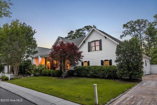 3108 Rivendell Pl, Wilmington, NC 28411 - view of front facade with a lawn and brick siding