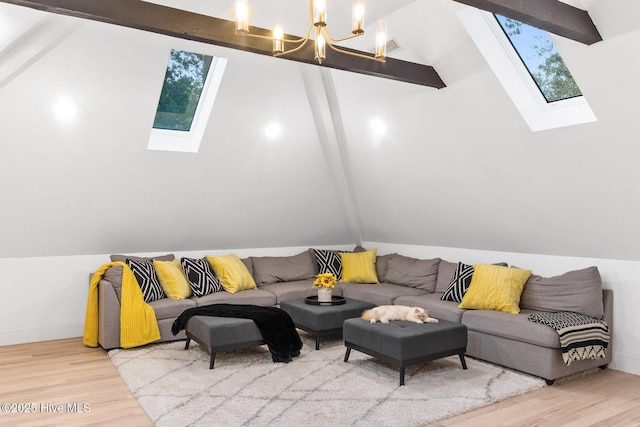 3108 Rivendell Pl, Wilmington, NC 28411 - living room featuring a skylight, wood finished floors, a chandelier, and vaulted ceiling