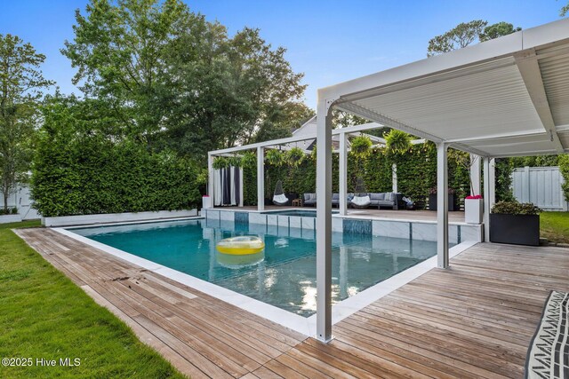 3108 Rivendell Pl, Wilmington, NC 28411 - view of pool with outdoor lounge area, a fenced backyard, and a wooden deck