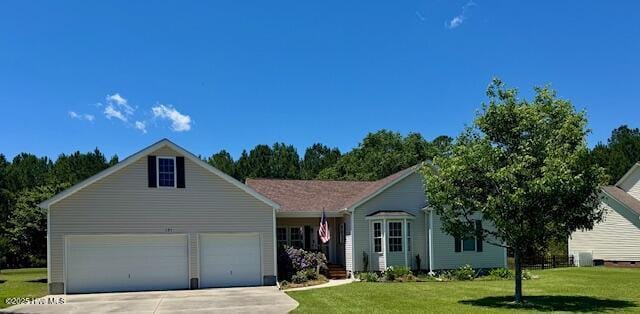 151 N Mitchell Way, Havelock, NC 28532 - view of front of home with concrete driveway, a front yard, and a garage