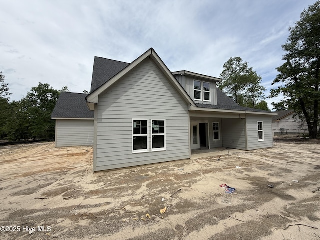 520 Harrow Dr, Carthage, NC 28327 - back of property with a shingled roof and a patio area
