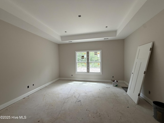 520 Harrow Dr, Carthage, NC 28327 - spare room featuring a tray ceiling and baseboards