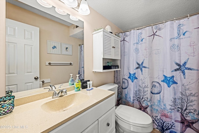2000 New River Inlet Rd Unit 1208, North Topsail Beach, NC 28460 - full bath featuring vanity, toilet, a textured ceiling, and a shower with shower curtain