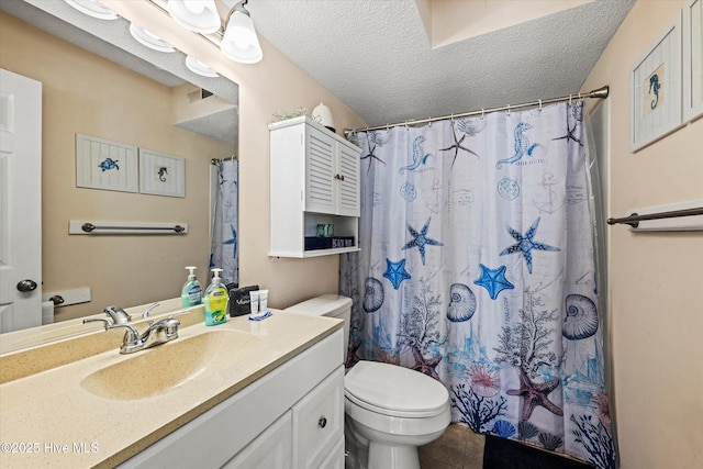 2000 New River Inlet Rd Unit 1208, North Topsail Beach, NC 28460 - full bath with toilet, vanity, a textured ceiling, tile patterned floors, and curtained shower