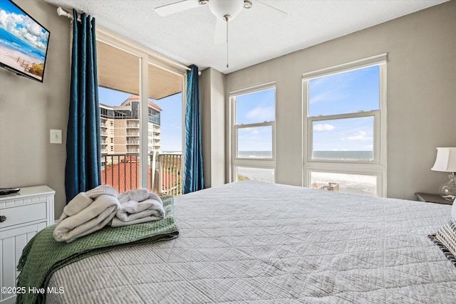2000 New River Inlet Rd Unit 1208, North Topsail Beach, NC 28460 - bedroom with access to exterior and ceiling fan
