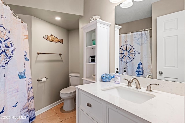 2000 New River Inlet Rd Unit 1208, North Topsail Beach, NC 28460 - bathroom featuring toilet, vanity, tile patterned flooring, baseboards, and recessed lighting