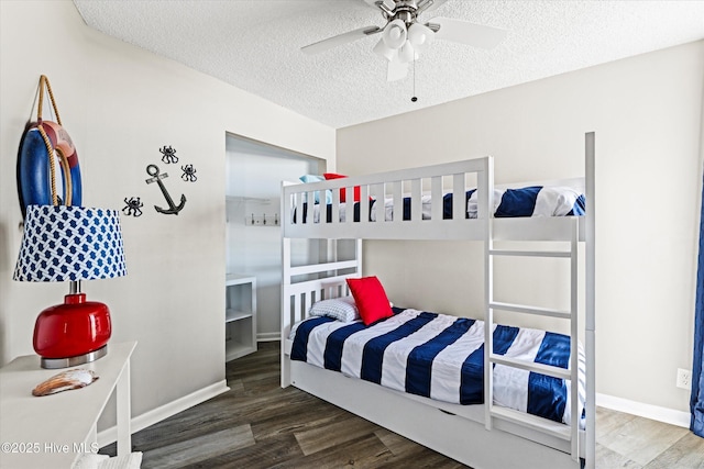 2000 New River Inlet Rd Unit 1208, North Topsail Beach, NC 28460 - bedroom with a textured ceiling, wood finished floors, baseboards, and a ceiling fan