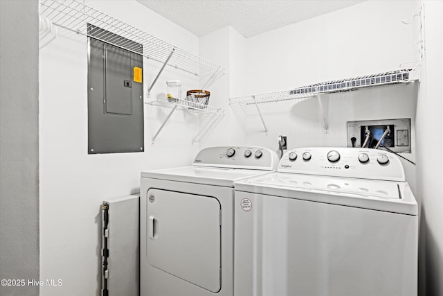 2000 New River Inlet Rd Unit 1208, North Topsail Beach, NC 28460 - laundry room featuring electric panel and washer and clothes dryer